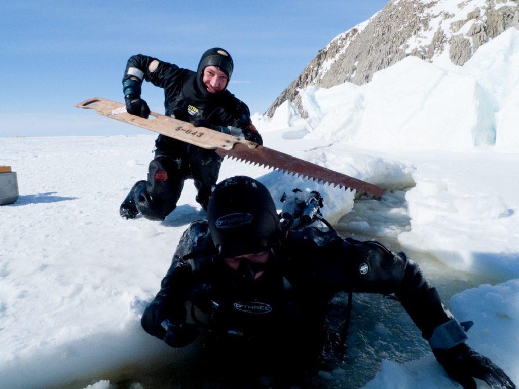 Doug Anderson and Hugh Miller preparing to dive in crack on sea ice for BBC’s Frozen Planet - Ross Island, Antartica  BBC Netflix Apple TV Wildlife Filming Filmmaking Underwater Natural History Ocean Cinematography Gates  Housings Nauticam REvo Rebreathers SCUBA