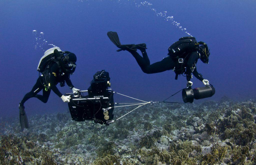 Doug Anderson and Hugh Miller use a underwater Scooter to move a 120KG Gates 3D camera housing in the Red Sea for BBC Enchanted Kingdom  BBC Netflix Apple TV Wildlife Filming Filmmaking Underwater Natural History Ocean Cinematography Gates  Housings Nauticam REvo Rebreathers SCUBA